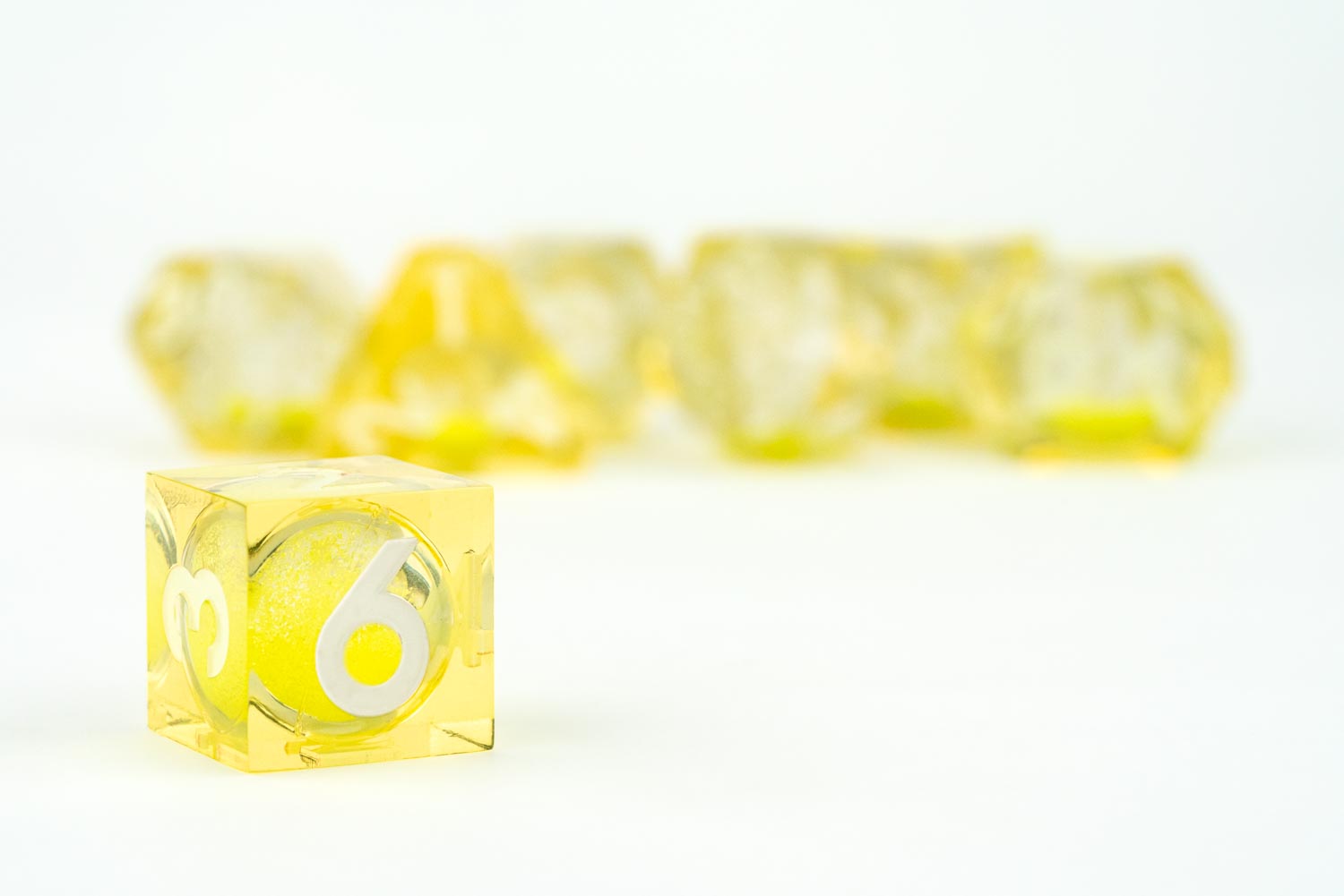 Single dice image of Shadow Light UV Reactive Elixir Liquid Core RPG Dice