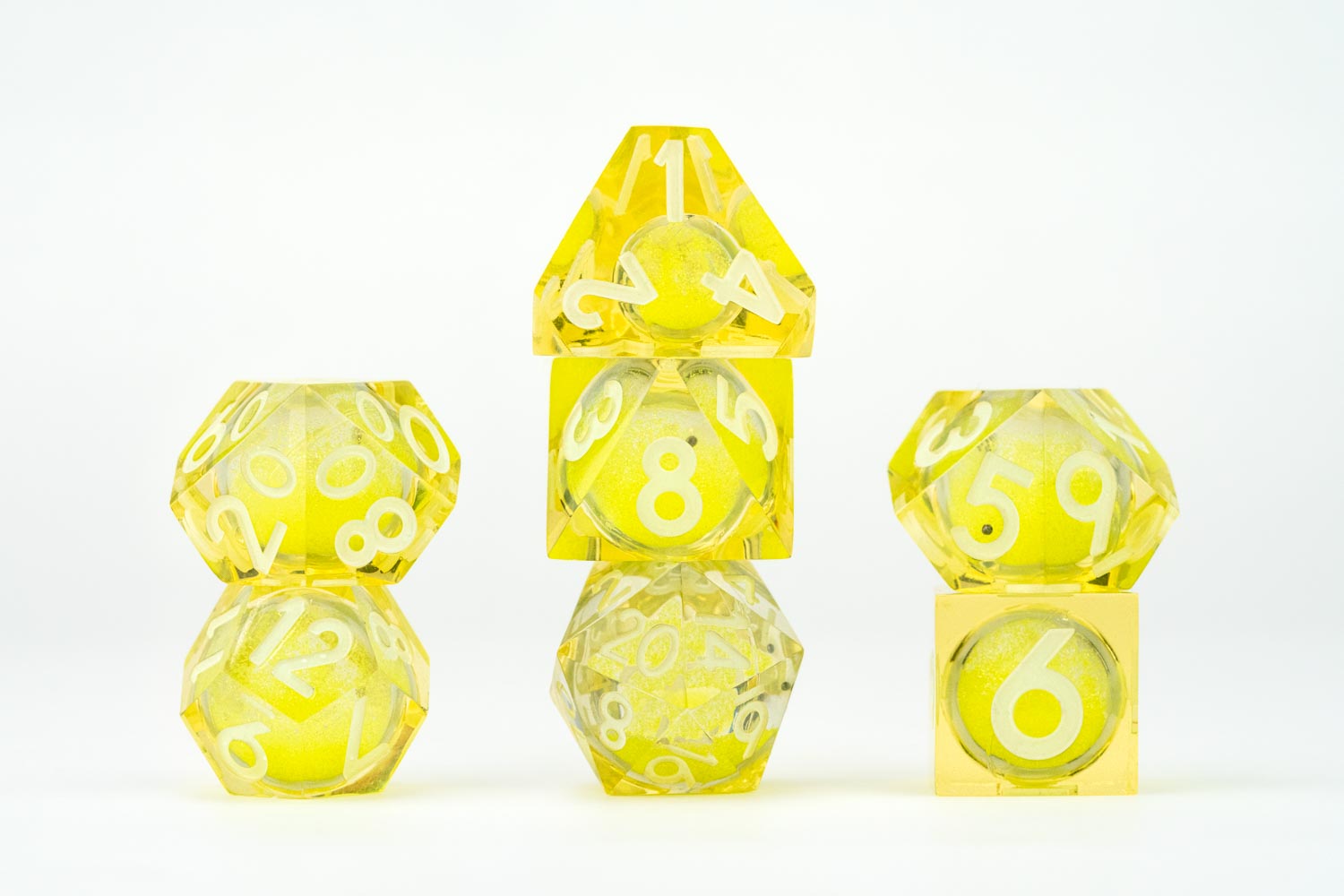 All included dice in Shadow Light UV Reactive Elixir Liquid Core RPG Dice Set