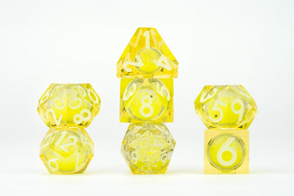 All included dice in Shadow Light UV Reactive Elixir Liquid Core RPG Dice Set