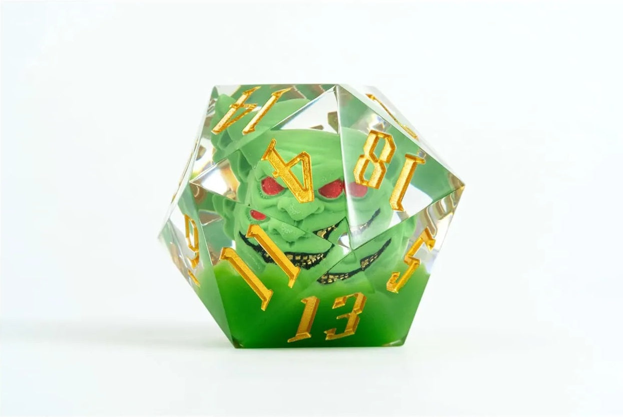 Clear green d20 dice with a snarling green goblin head (red eyes) inside and gold numbers
