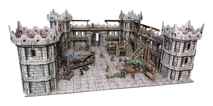 A detailed tabletop fantasy castle courtyard model with stone walls, battlements, market stalls, and miniature figures.