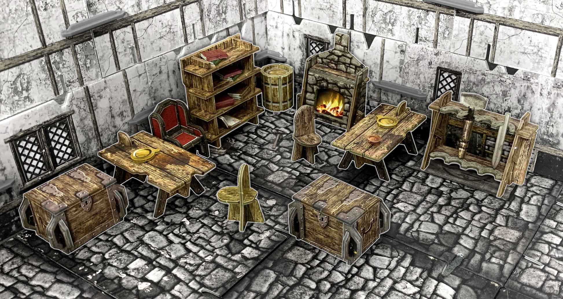 Papercraft medieval room for tabletop RPGs, featuring tables, chairs, chests, fireplace, bookshelf, and a loom.