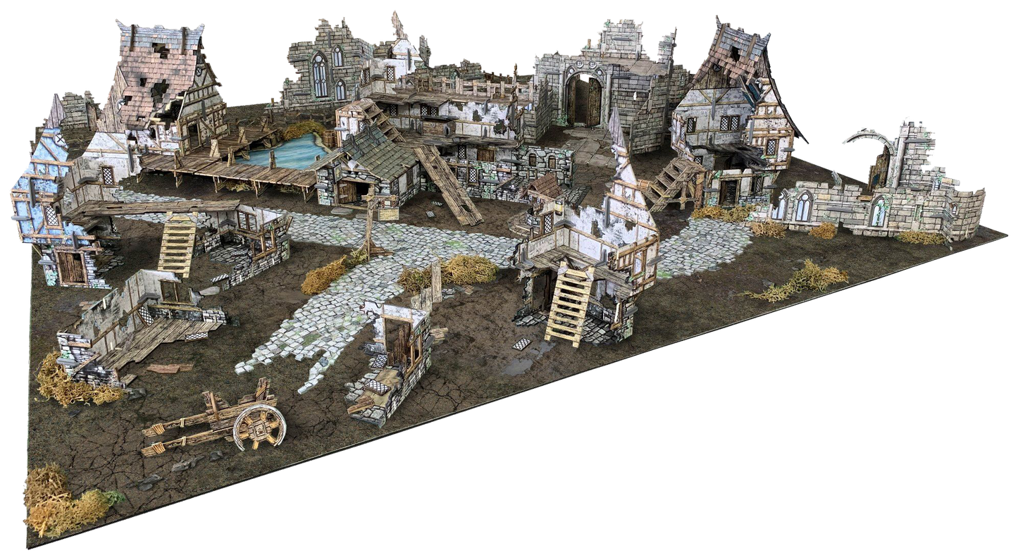 A detailed diorama of a ruined medieval village with crumbling buildings, cobblestone paths, a pond, and an old cart.