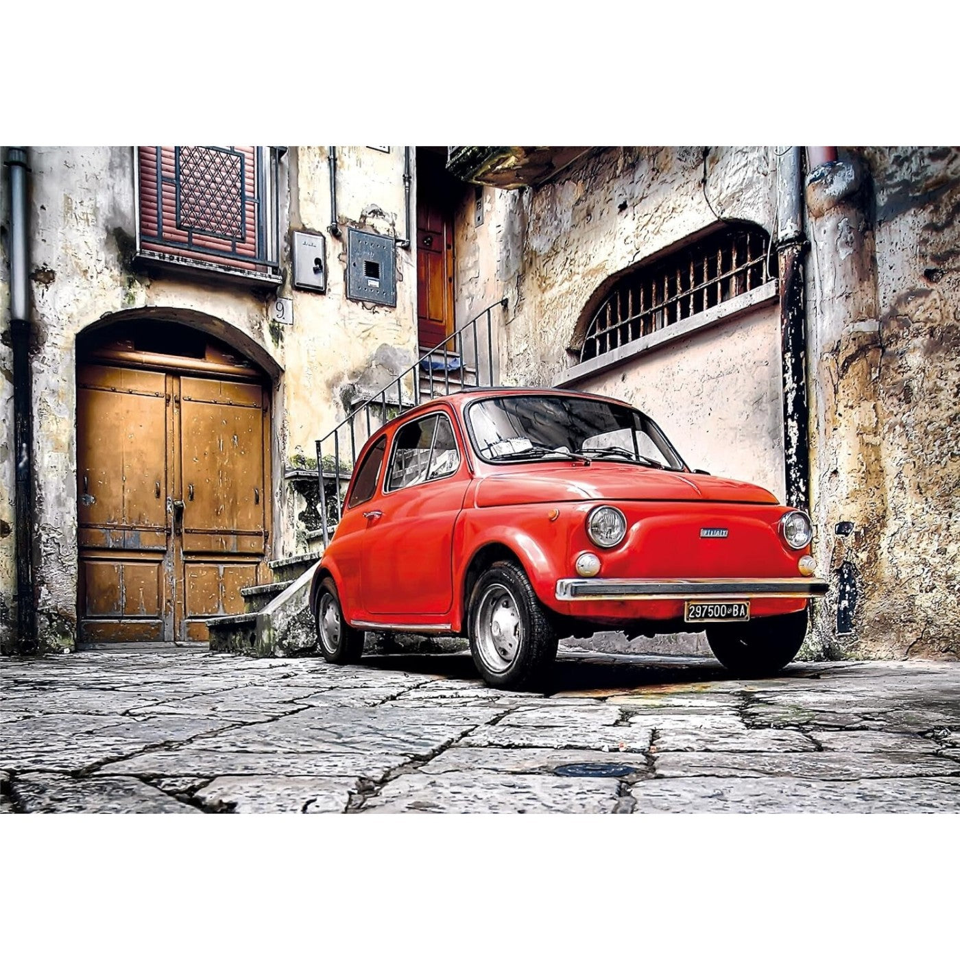Bright red vintage Fiat 500 car parked on a cobblestone street in a rustic European alley.