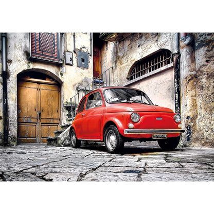 Bright red vintage Fiat 500 car parked on a cobblestone street in a rustic European alley.