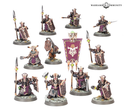 A unit of 11 heavily armored Duardin (dwarf-like) miniatures with spears, shields, hammers, and a banner