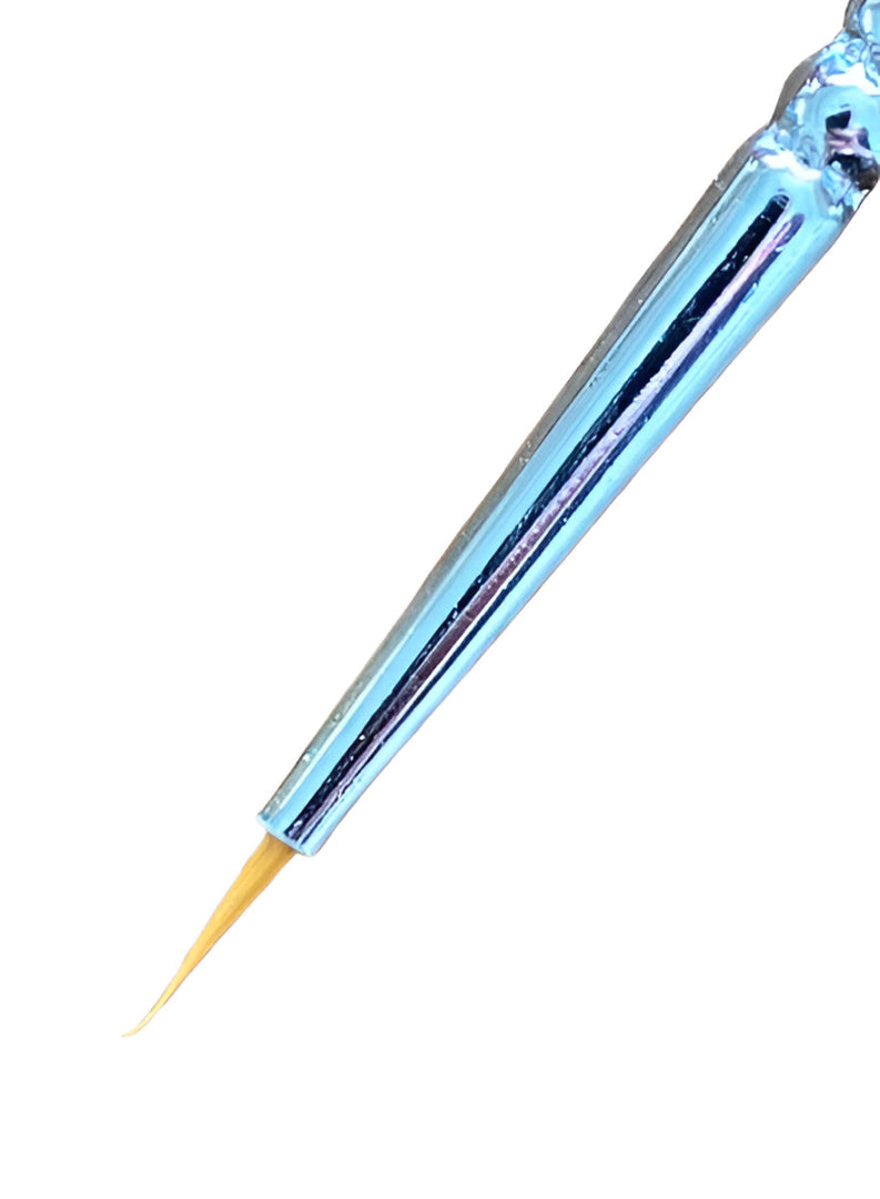 Metallic blue fine-liner brush with a pointed tan tip, on white