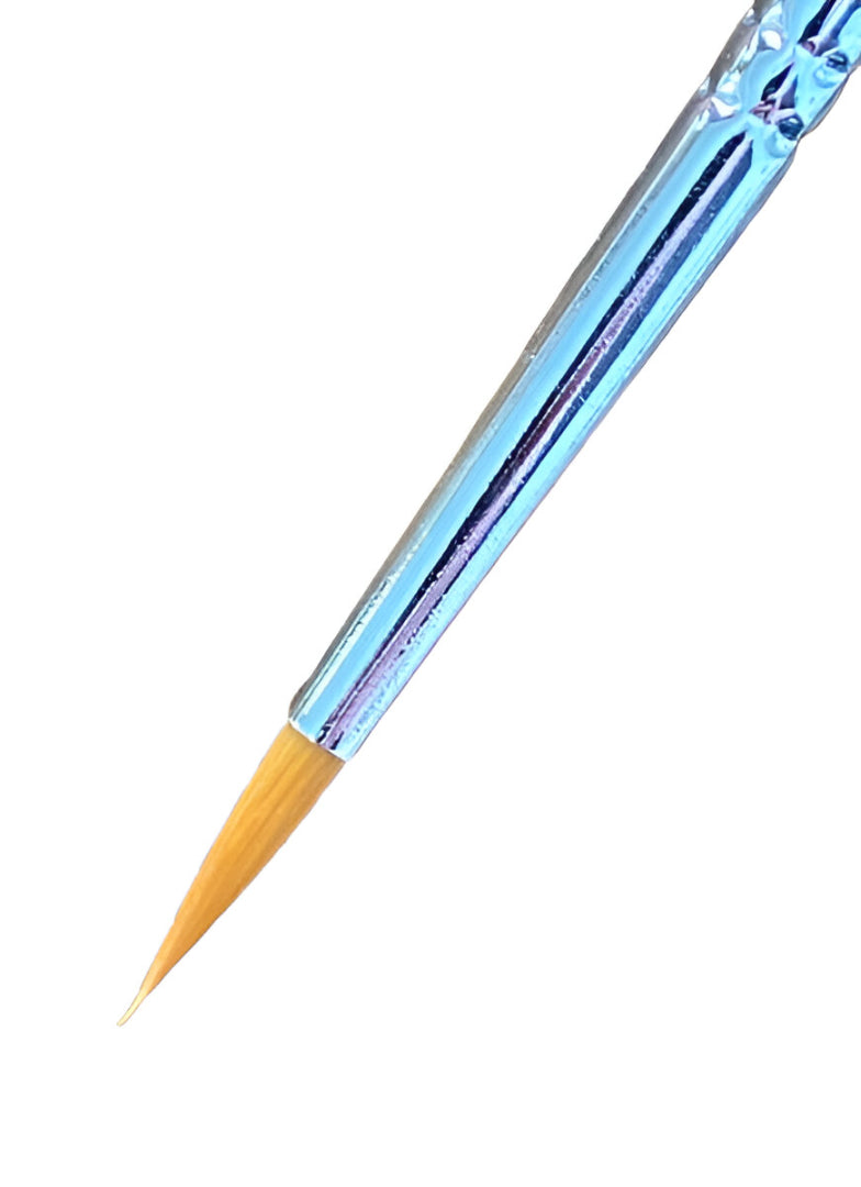 A blue iridescent detail brush with a thin, pointed tan bristle tip shown against a white background