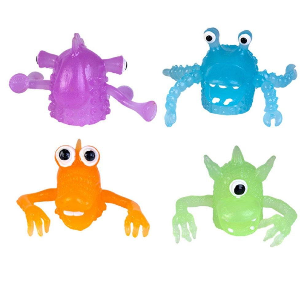 Four colorful, translucent monster finger puppets in purple, blue, orange, and green