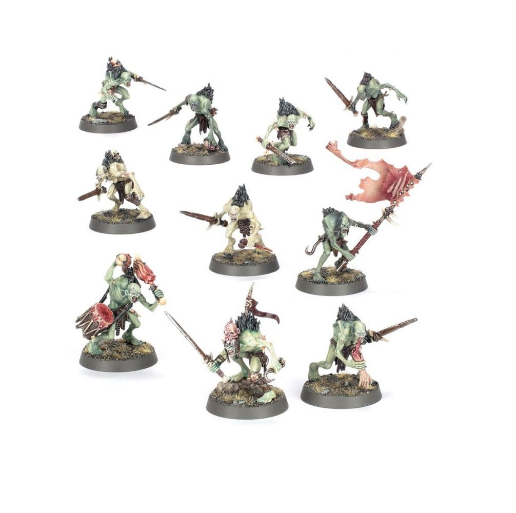 Set of 11 painted green and pale miniature ghoul figures armed with swords, spears and a banner