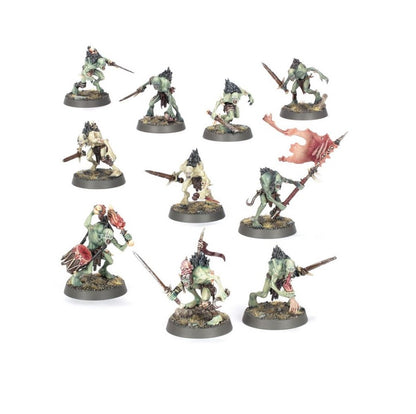 Set of 11 painted green and pale miniature ghoul figures armed with swords, spears and a banner