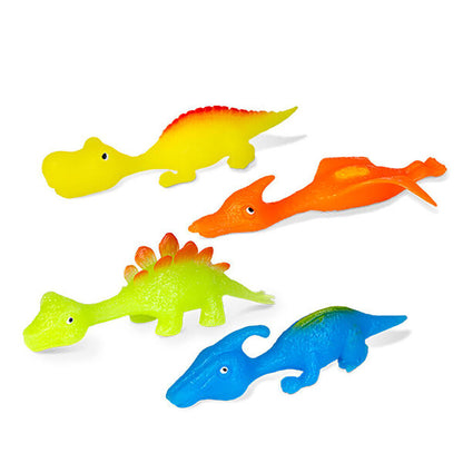 Four colorful toy dinosaurs: yellow long-neck, orange flying, green plated, and blue crested
