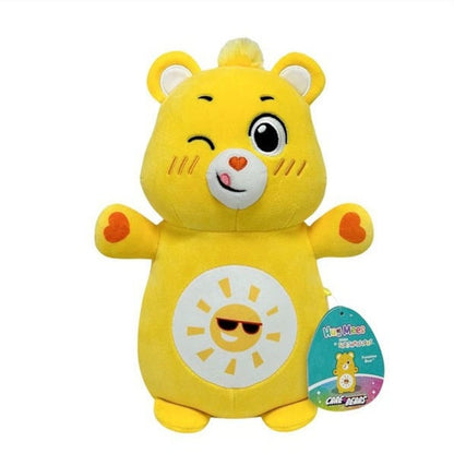 Yellow Care Bears Hug Mees Funshine Bear plush toy winking, with sun belly badge and tag, white background