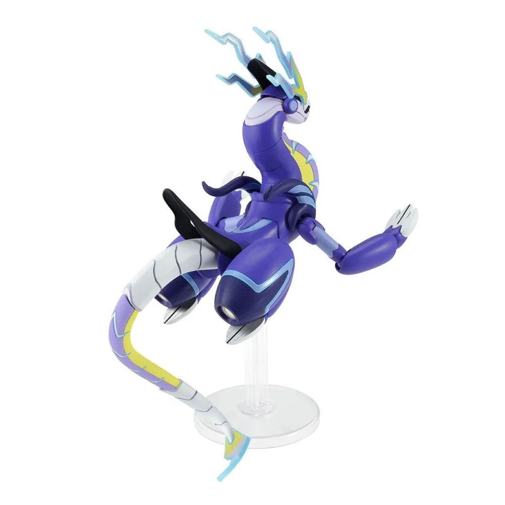 Purple robotic dragon figure (Miraidon) posed flying on a clear stand against a white background