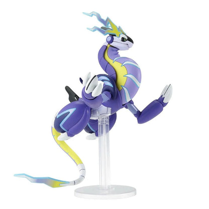Miraidon Pokémon action figure (purple, yellow, and blue dragon) posed dynamically on a clear display stand