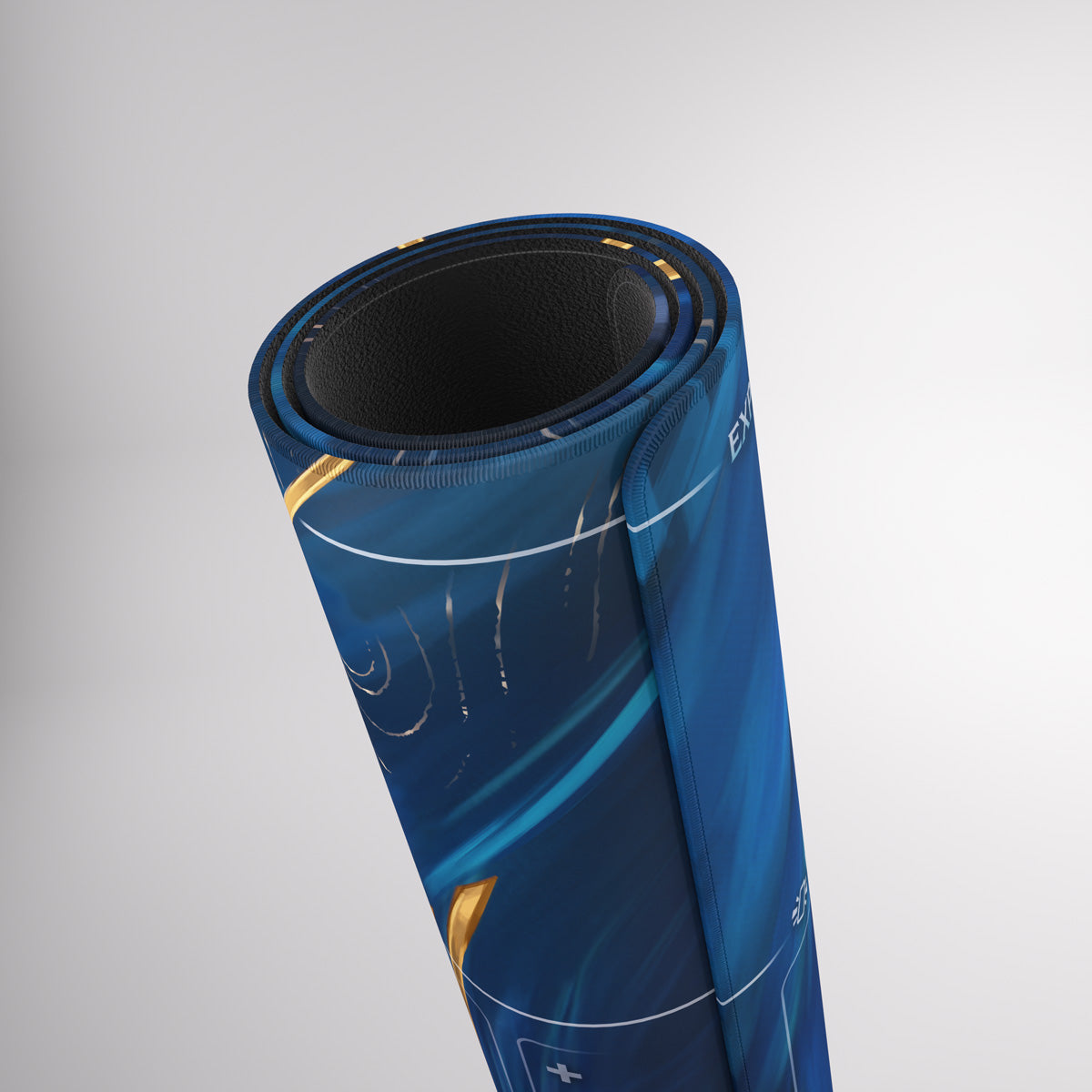 A vertically rolled blue Gamegenic playmat with abstract designs, revealing its black textured underside