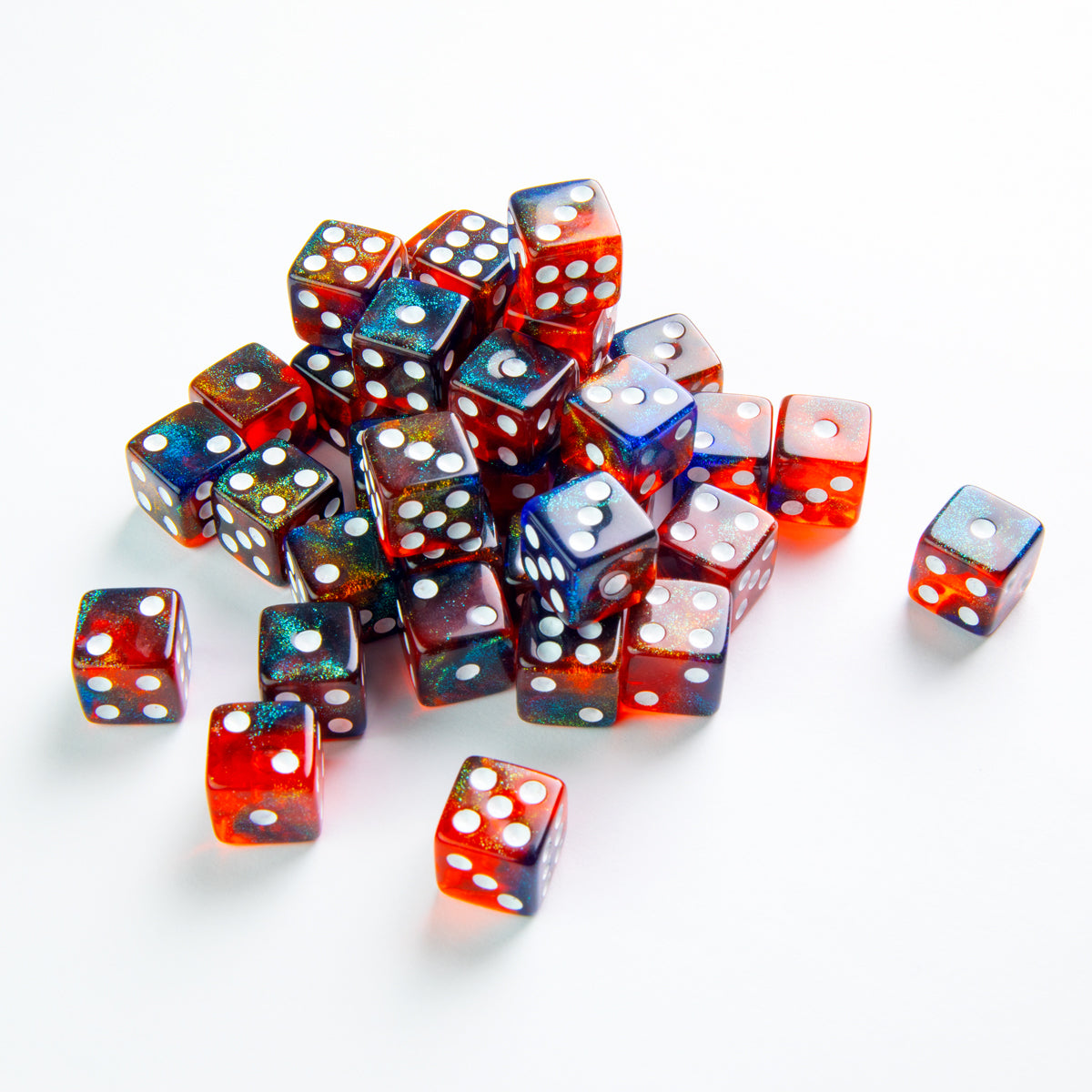 Gamegenic Galaxy Series 12mm D6 dice set featuring swirling blue red and gold metallic colors with white pips scattered on a white background