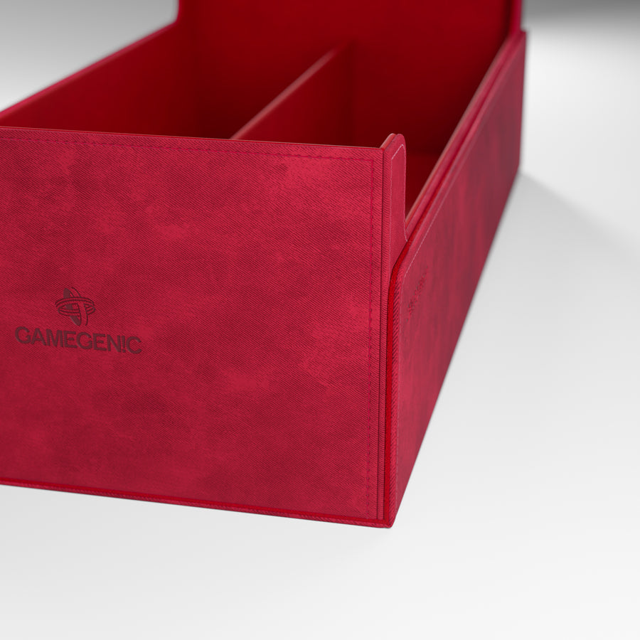 A close-up of a red, textured Gamegenic storage box with visible stitching and internal dividers