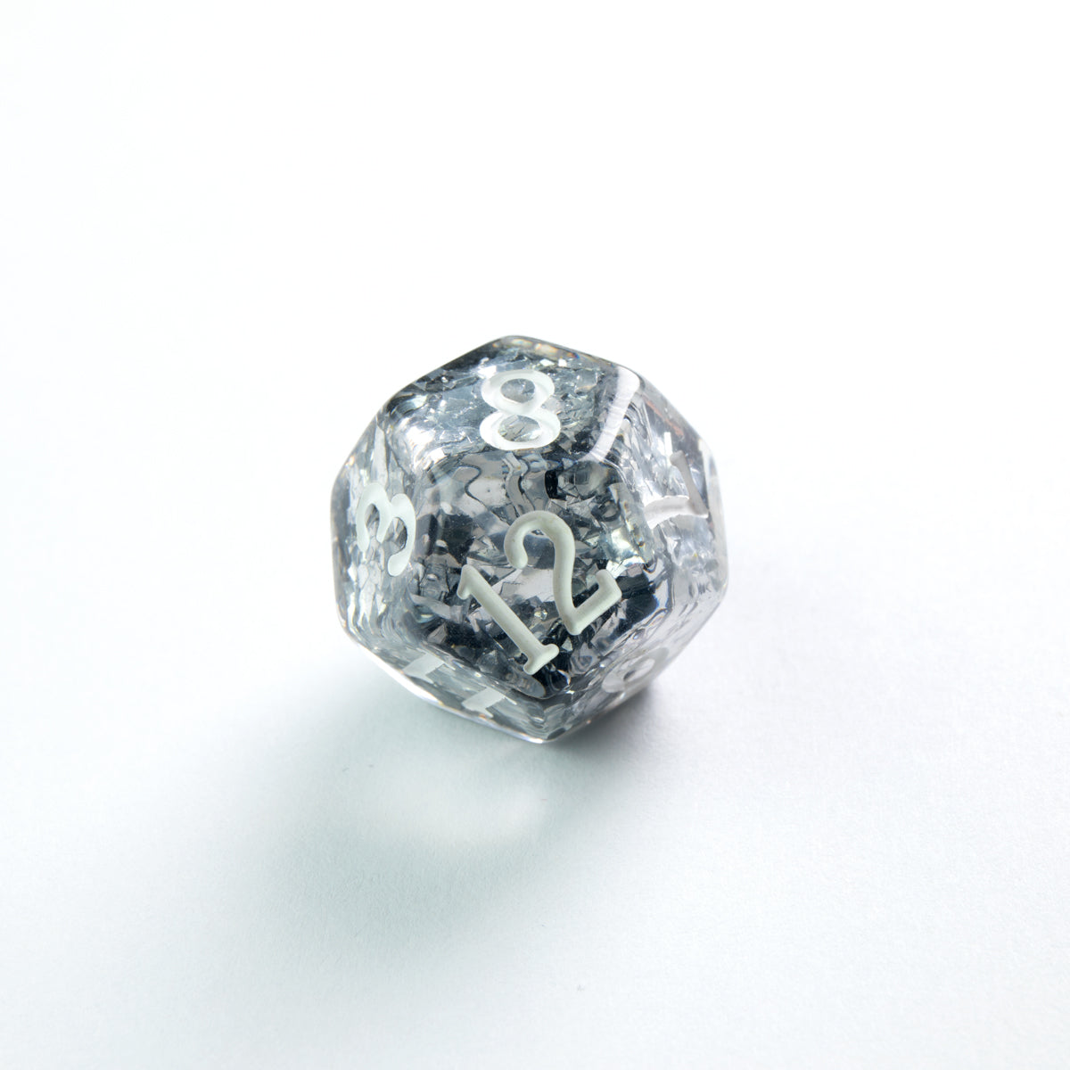 Clear d20 dice with silver glitter and white numbers '8', '12' on a white background