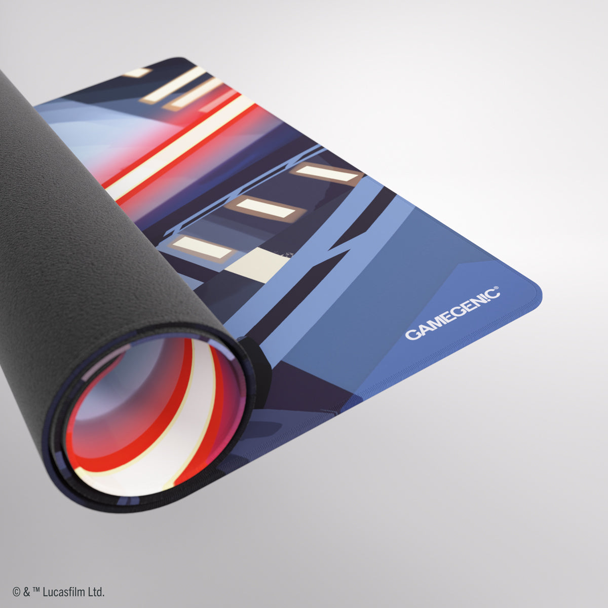 Partially rolled Gamegenic playmat with a black base and a blue, red, and white futuristic design