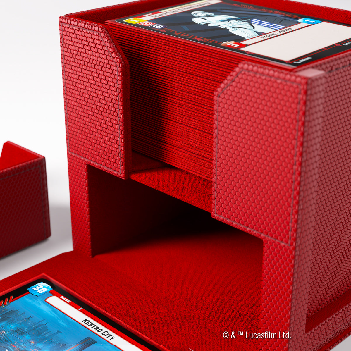 Red textured card deck box holds a stack of Star Wars trading cards, with an empty compartment below