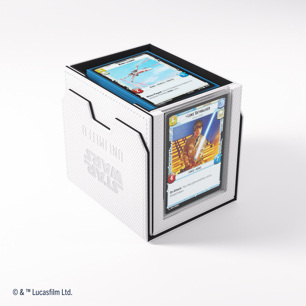 White Star Wars: Unlimited card box holds a stack of cards, with a Luke Skywalker card displayed in front