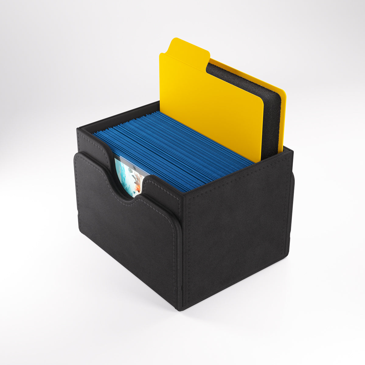 Divider placed in a black card storage box with sleeved cards