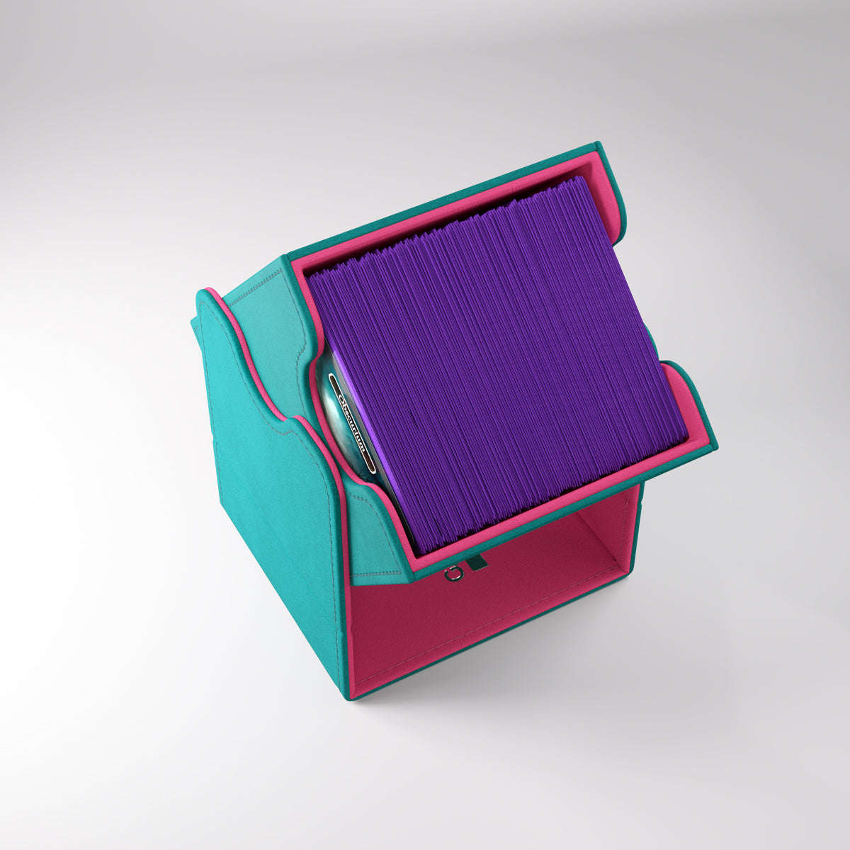 Teal and pink Gamegenic deck box holding purple-sleeved cards, tilted open for display