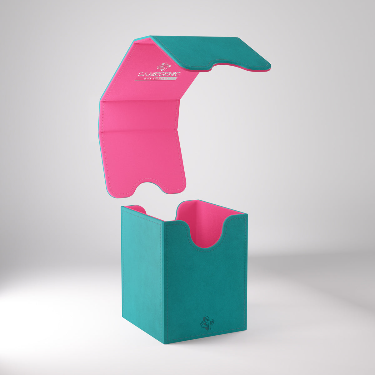 Teal and pink Gamegenic deck box with its magnetic lid floating above, showing the interior