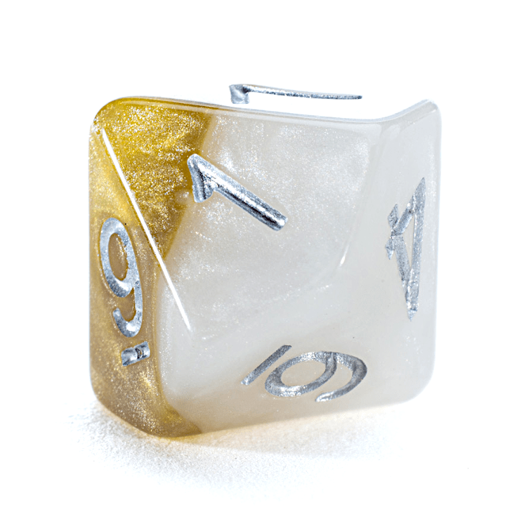 A shimmering gold glitter and pearlescent white d20 dice with silver numbers 9, 10, and 11 visible.