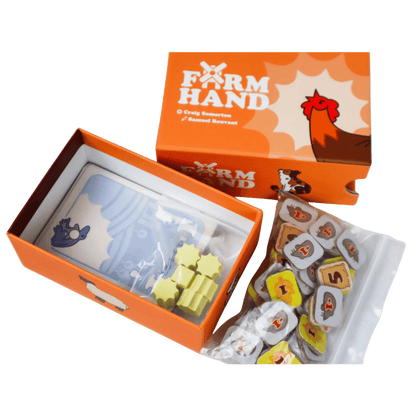 Open Farm Hand board game box displaying cards, yellow wooden tokens, and a bag of animal scoring tiles