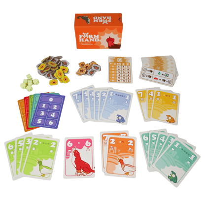 Farm Hand card game contents: box, stacks of colorful cards featuring farm animals, number cards, tokens, and scoring sheet