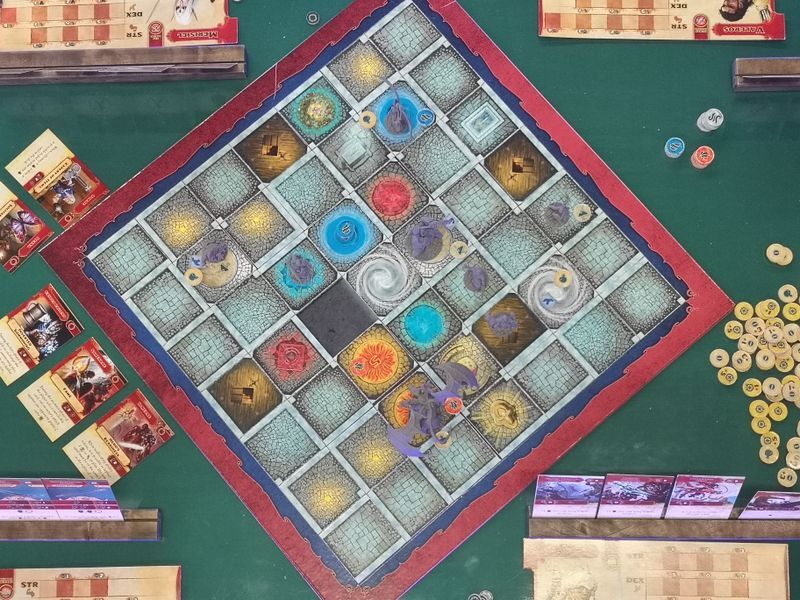 Board game setup with miniatures and player pieces in action