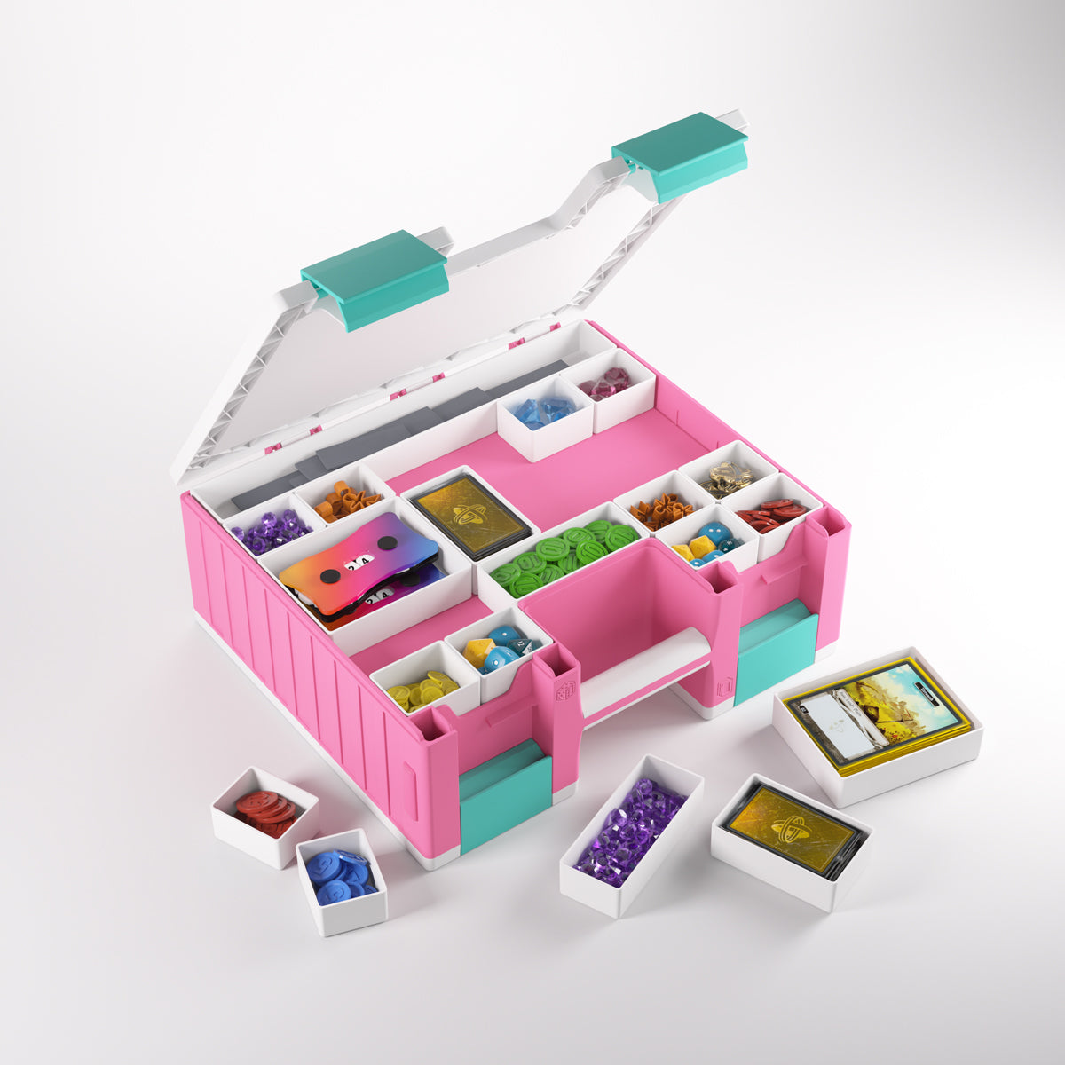 Open pink and white game organizer box filled with colorful tokens, cards, and dice, Smaller trays with pieces are beside it