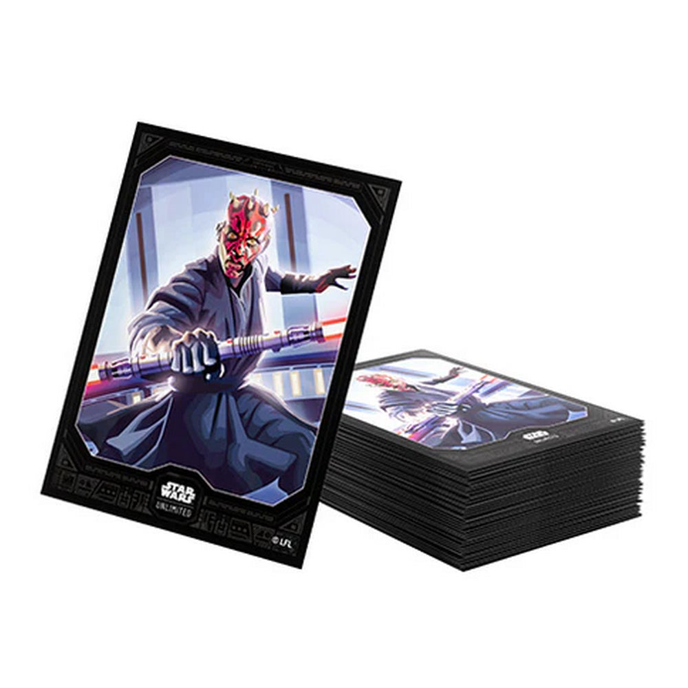 A single Star Wars trading card featuring Darth Maul with a double red lightsaber, beside a stack of cards