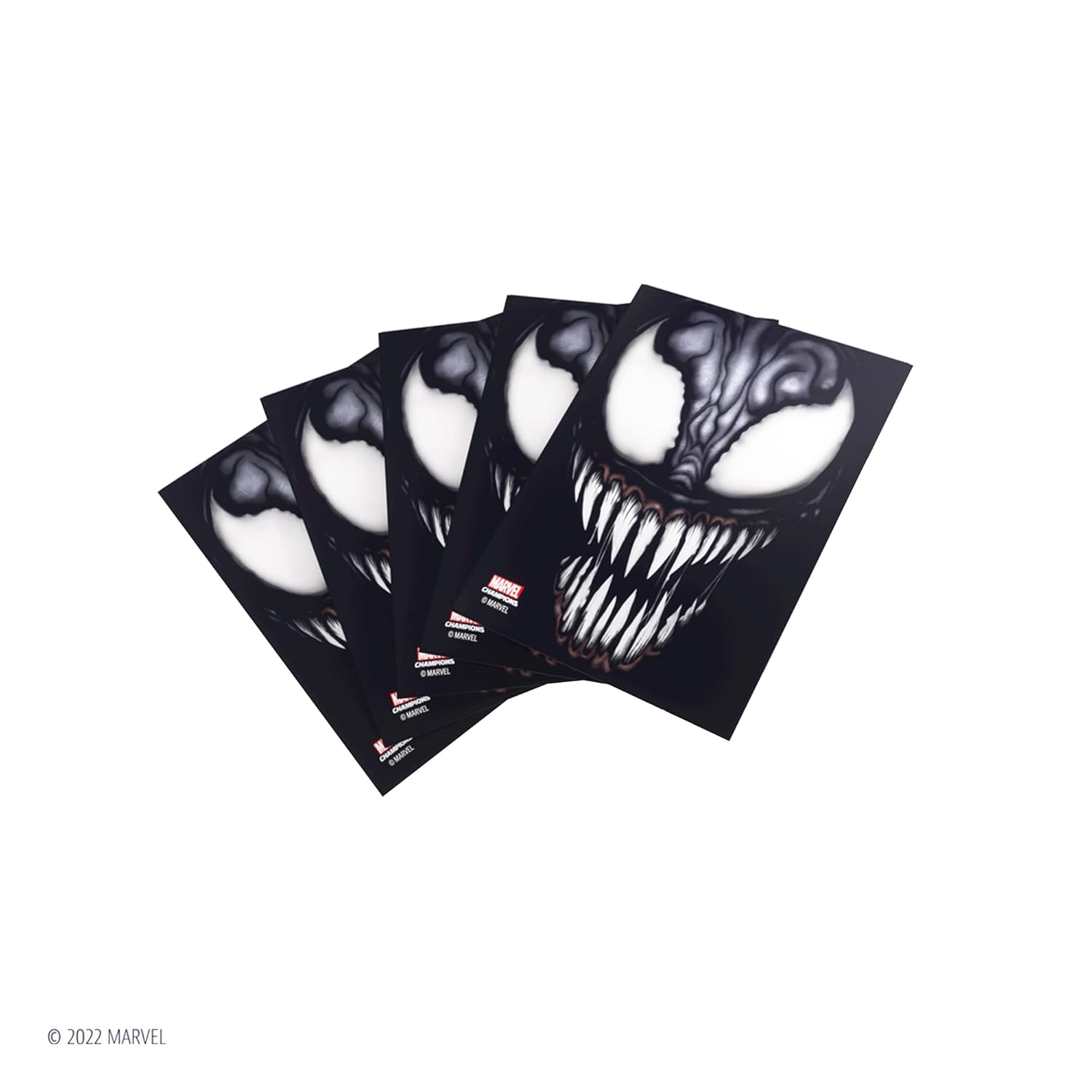 Fanned stack of four black Marvel card sleeves printed with Venom's face and sharp teeth