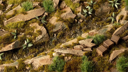 Miniature rocky landscape terrain with moss, a wet creek bed, and three small wooden crates
