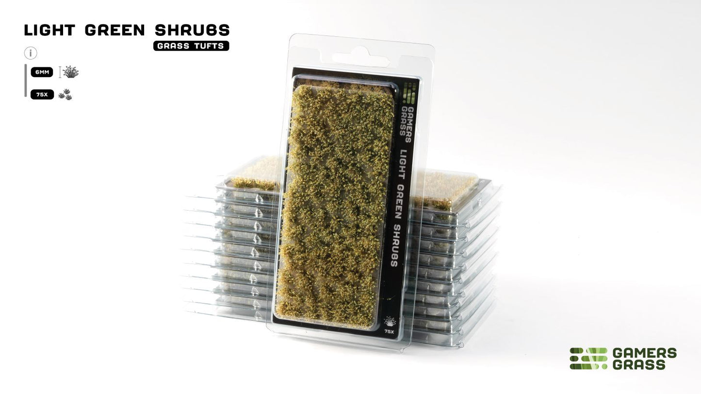 Gamers Grass Light Green Shrubs, 6mm grass tufts. One package stands upright, backed by a stack of more packs