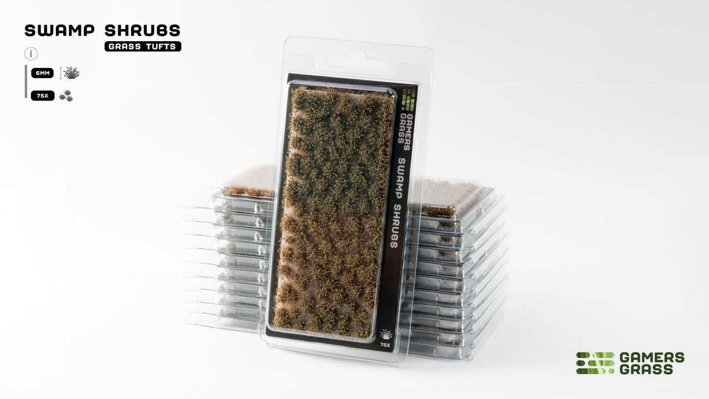 Gamers Grass 'Swamp Shrubs' miniature tufts (dark/light green-brown) in a clear package, with a stack of packs behind