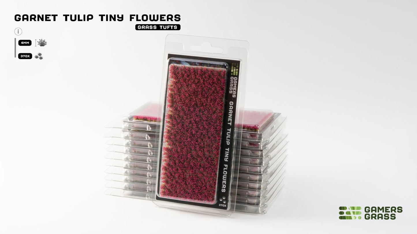 Stack of Gamers Grass 'Garnet Tulip Tiny Flowers' in clear blister packs. The 4mm deep red miniature tufts are ready for use