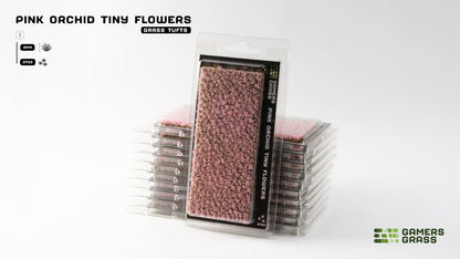 Stacked Gamers Grass 'Pink Orchid Tiny Flowers' miniature grass tuft packs. One upright, showcasing pink tufts