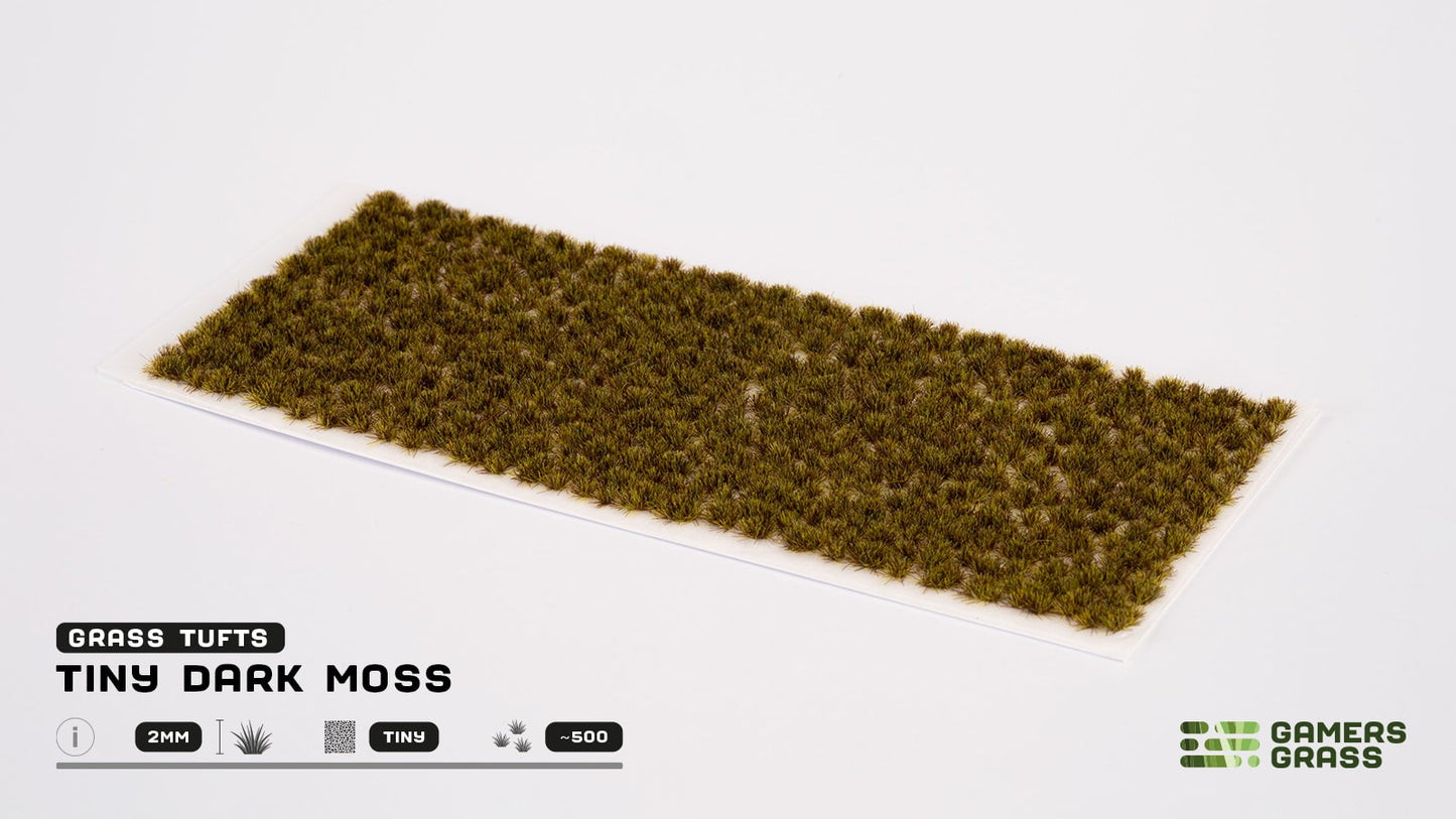 A rectangular sheet of Tiny Dark Moss model grass tufts for wargaming on a white background
