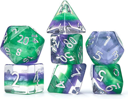 A set of 7 marbled green, purple, and clear polyhedral dice with silver numbers