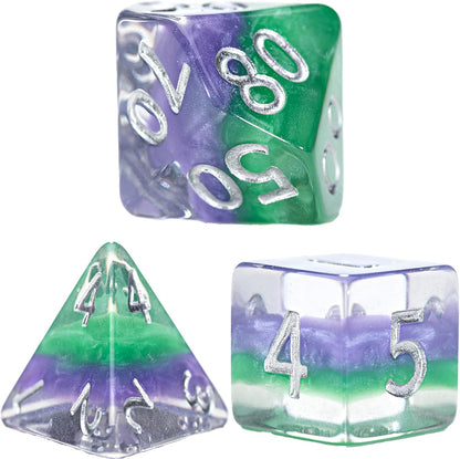 Three clear resin dice (d10, d4, d6) swirled with purple and green, displaying silver numbers