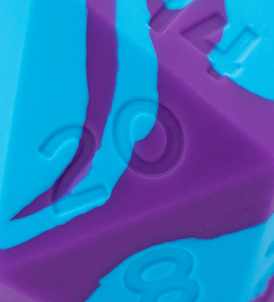 Turquoise and purple swirled polyhedral die with embossed numbers