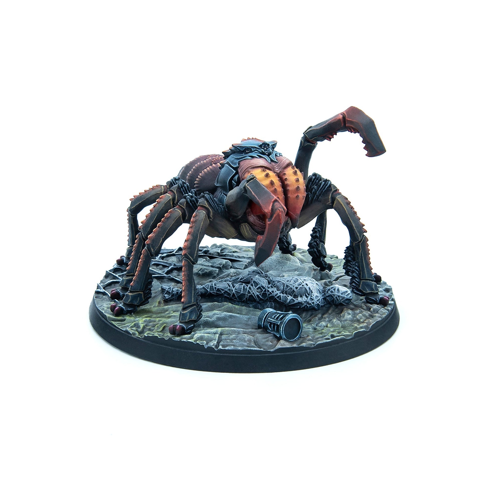 A painted miniature of a dark, armored multi-legged creature with red pincers on a debris-strewn base