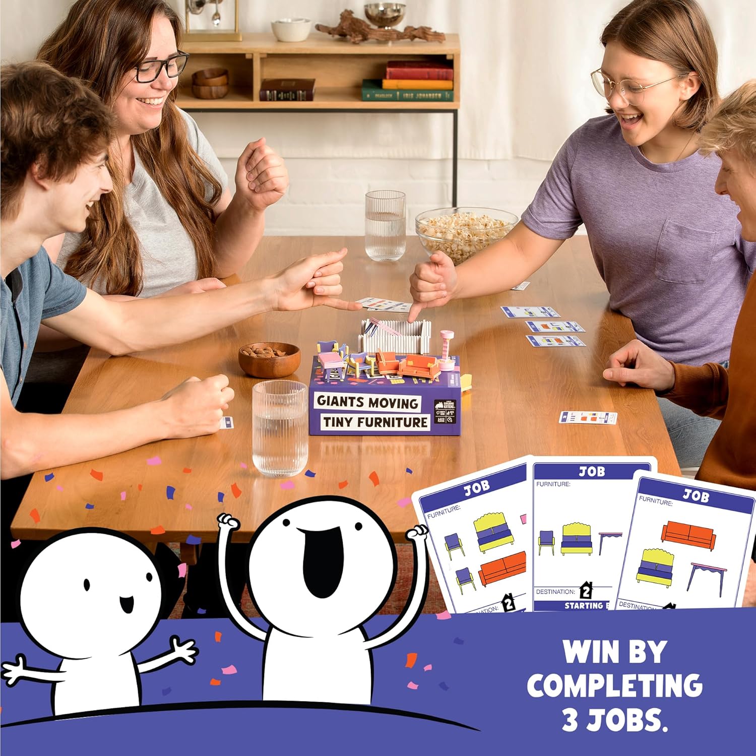 Smiling young adults play "Giants Moving Tiny Furniture" board game, featuring miniature furniture pieces on the table