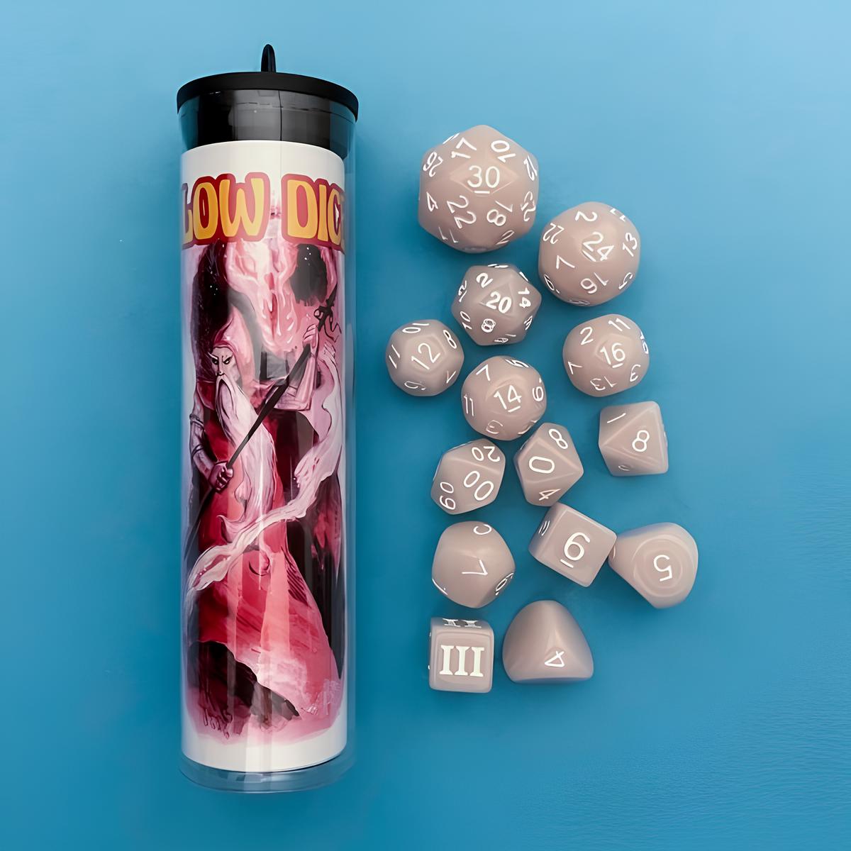 A tube with a wizard illustration and scattered light gray polyhedral RPG dice on a blue background.