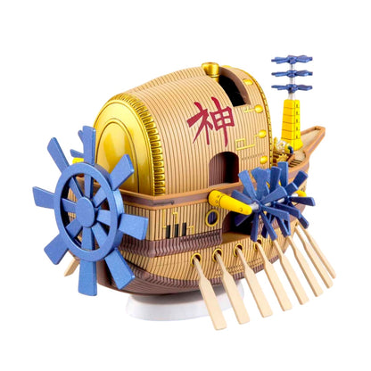A unique wooden ship model featuring a large golden deity face, multiple oars, and a side-mounted blue paddle wheel