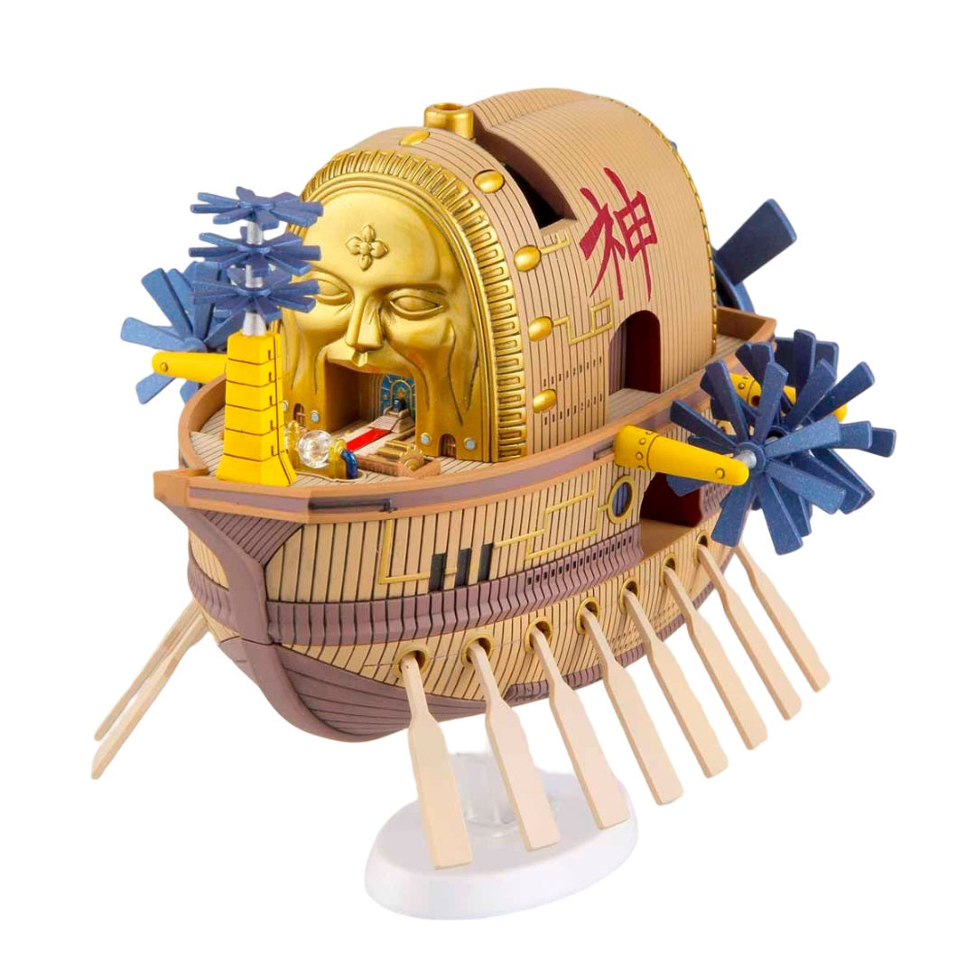 Golden barrel ship model with a face, oars, and paddle wheel, marked with a red kanji